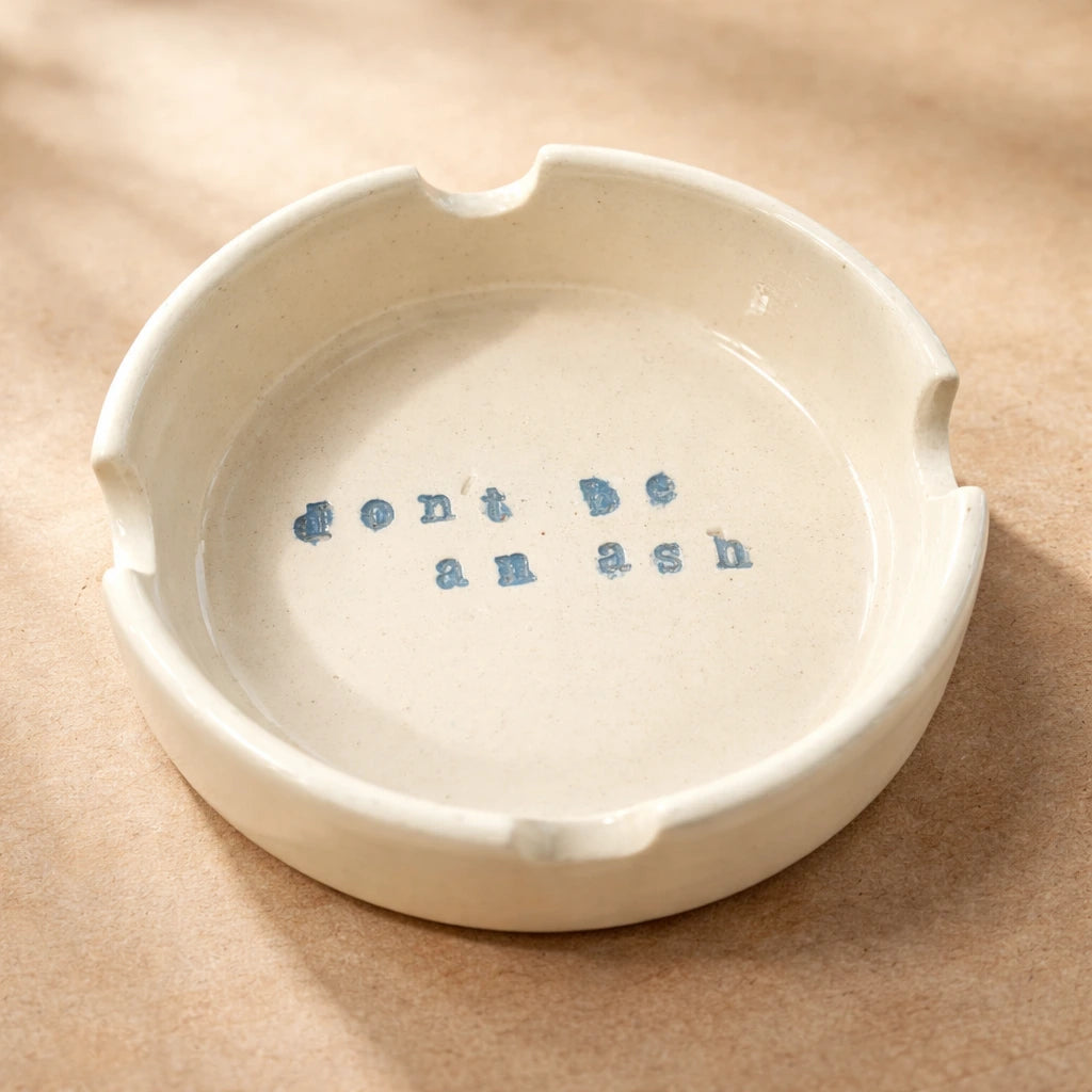 Ceramic Ashtray featuring a quirky message 'don't be an ash', showcasing unique handmade charm.