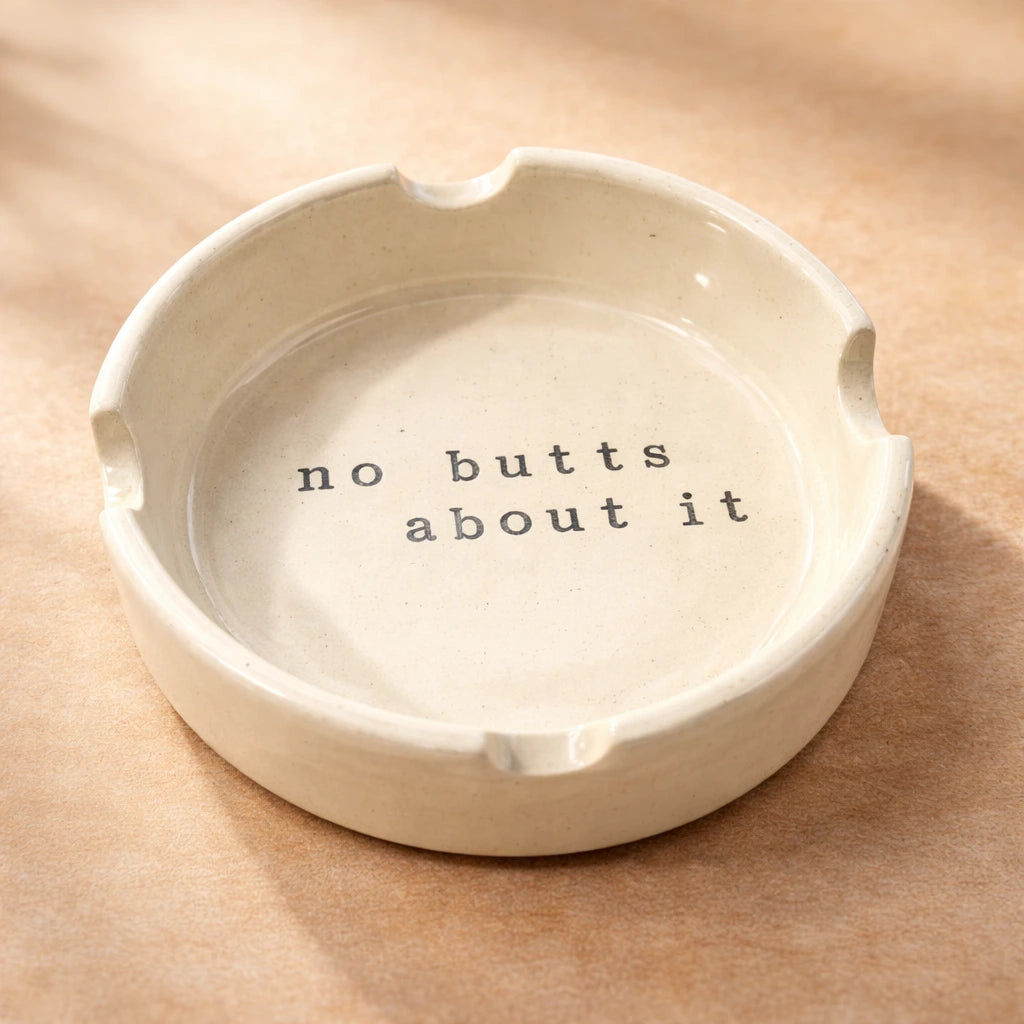 Ceramic Ashtray featuring a quirky message that says 'no butts about it', handcrafted ceramic design.