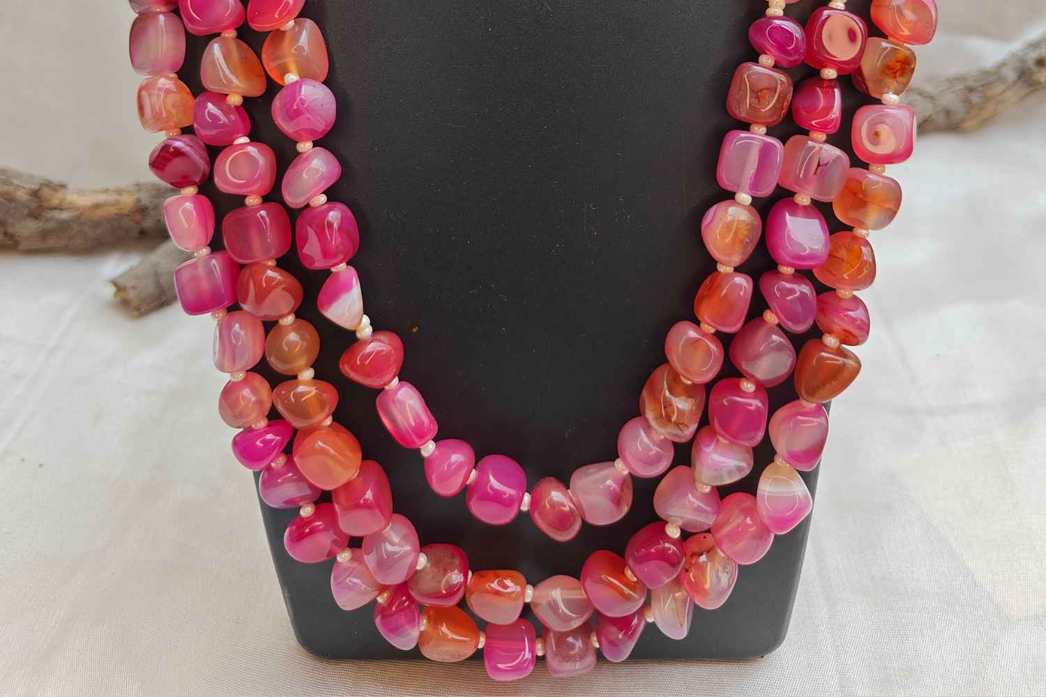 Bead Mala made of dark pink rhodonite stones, showcasing vibrant energy and emotional balance.
